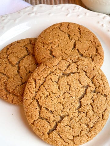 three ginger cookies on white plate