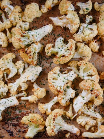 roasted cauliflower with golden brown florets and sprinkled with parsley
