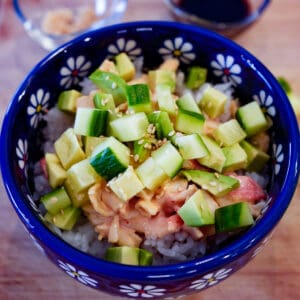spicy california sushi bowl with sticky rice, spicy surimi, diced cucumber and avocado
